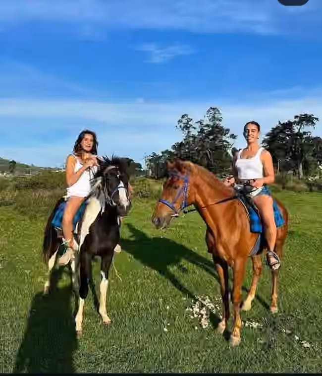 Two riders on horses in Nuwara Eliya