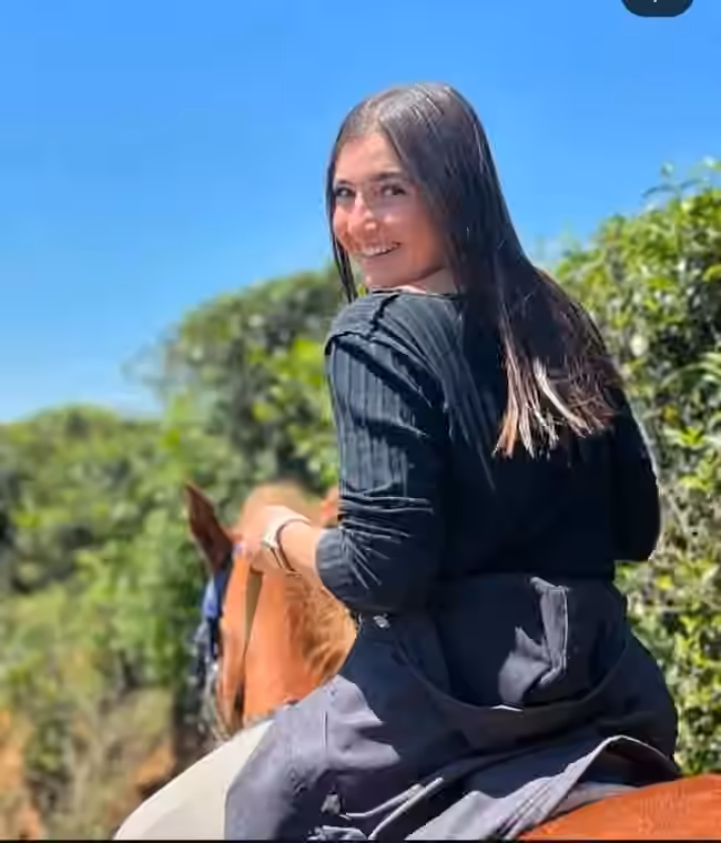 A smiling rider on horseback in Nuwara Eliya